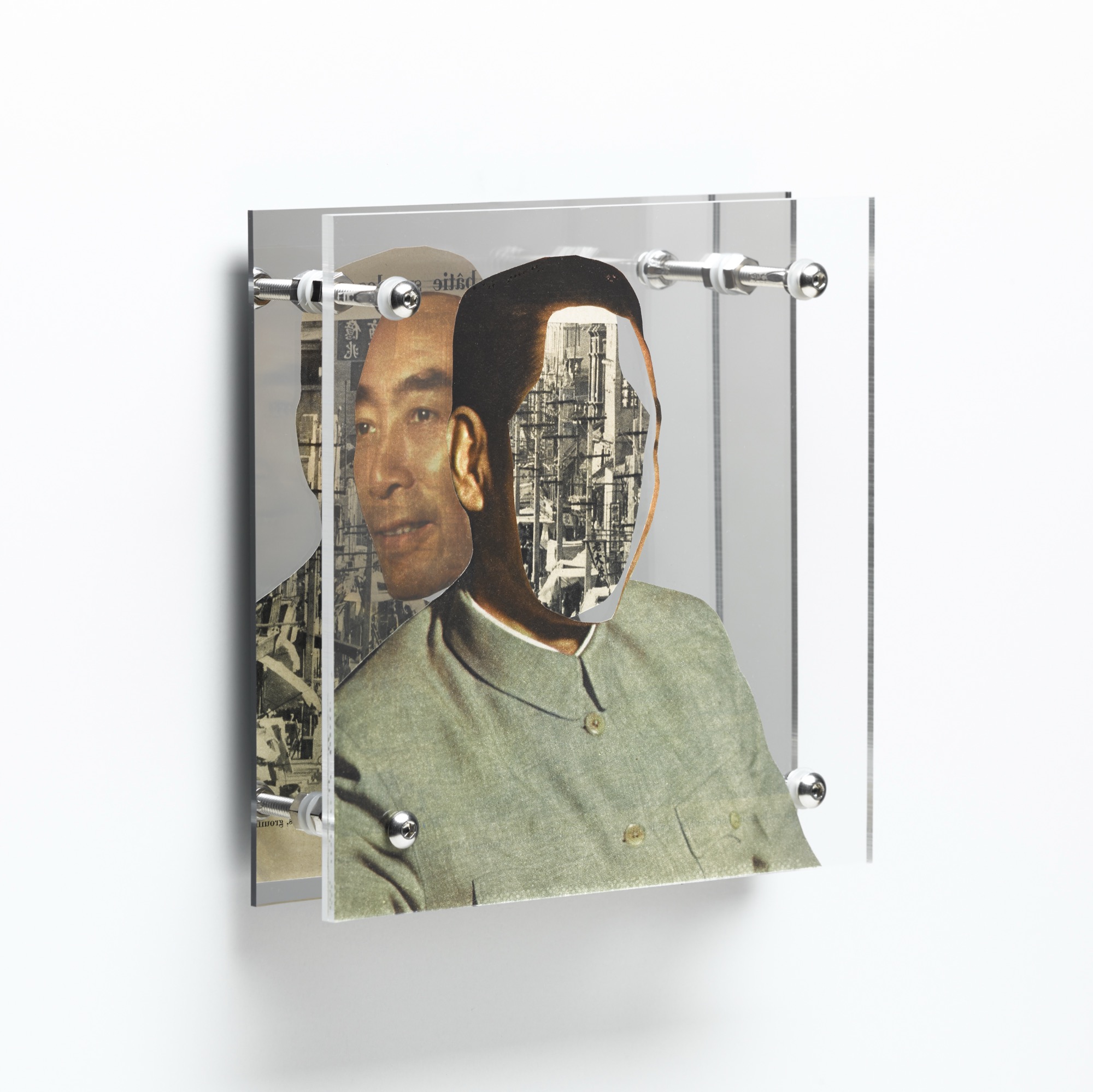 Derrière le sourire by Shannon Milar — Double Take series. Cut from mid-century magazines, found images and text are pressed between clear acrylic sheets set before a mirrored panel. A composed figure overlays an urban scene, the mirror revealing both faces of the printed page.