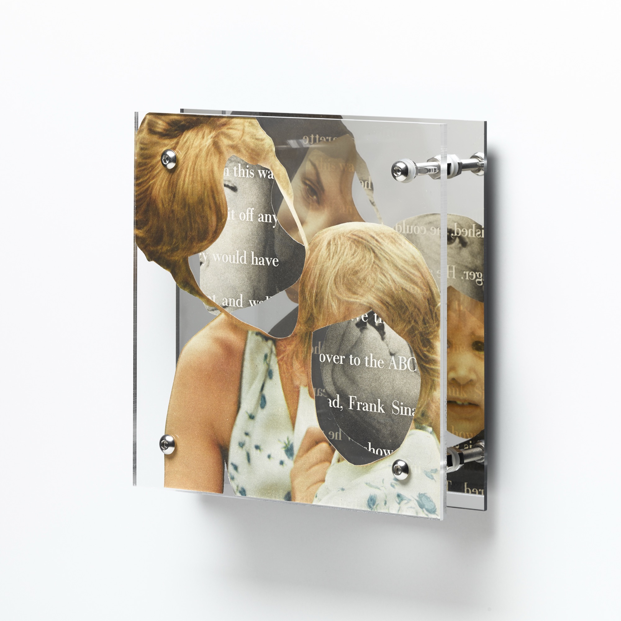 Looking forward by Shannon Milar — Double Take series. Cut from mid-century magazines, found images and text are pressed between clear acrylic sheets set before a mirrored panel. A family group is fragmented by mirrored reflection, where the printed text slips between affection and instruction.